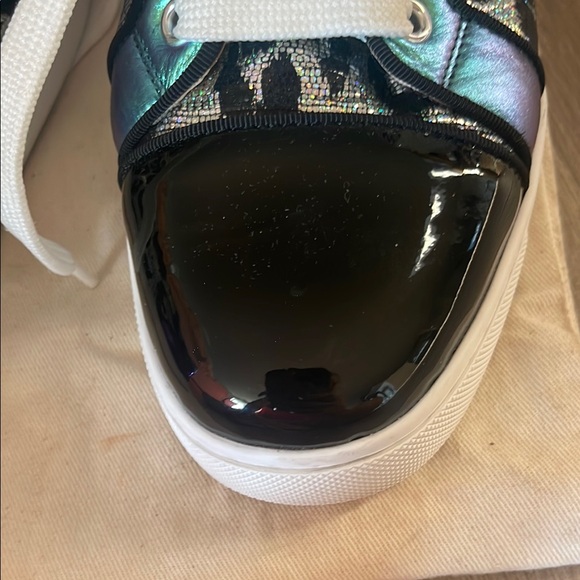 Black & Purple Women's Sneakers
made in Paris by Christian LOUBOUTIN
Red bottom - Picture 10 of 16